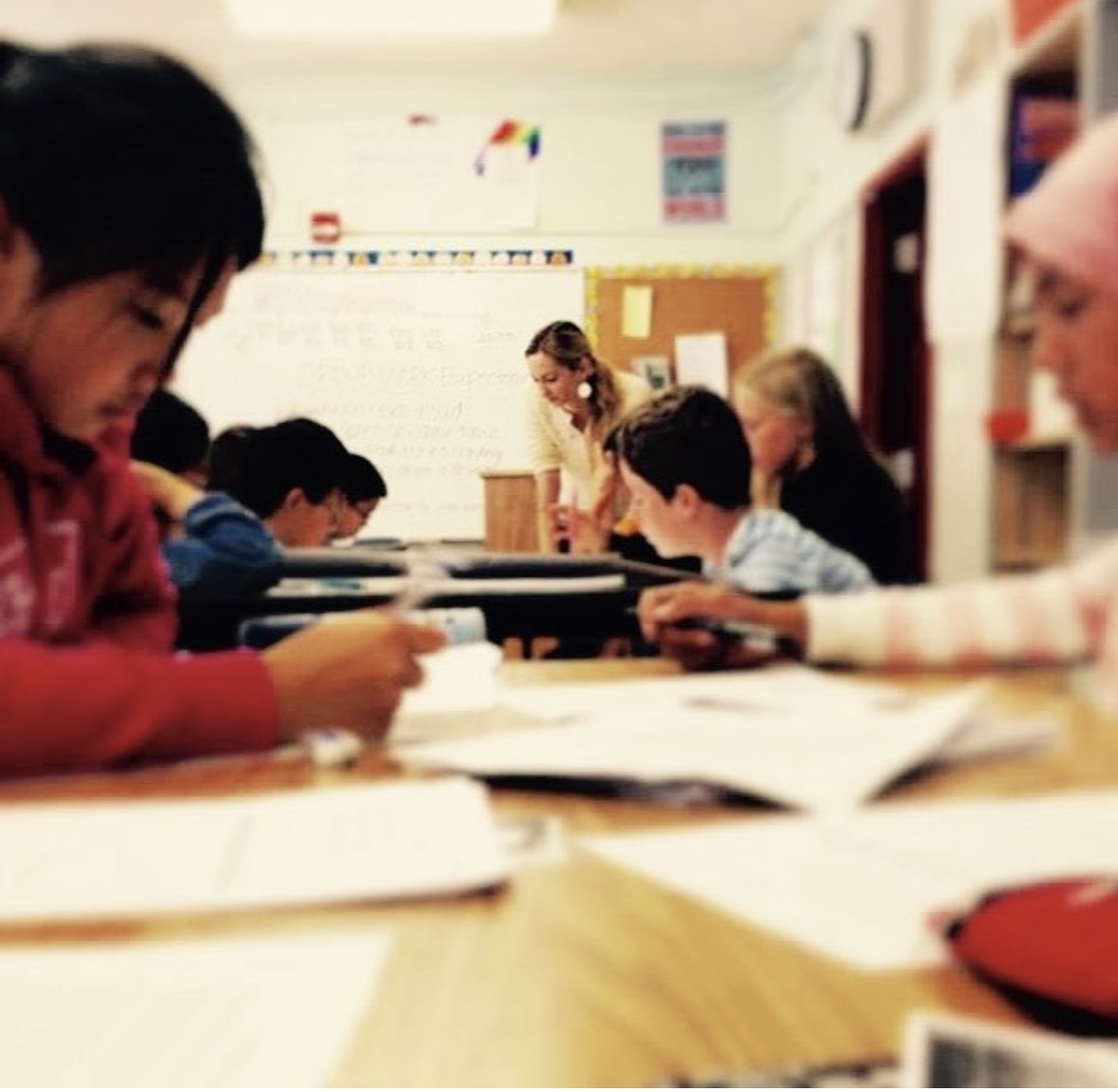 Courtney LaKroix working with students in a classroom setting